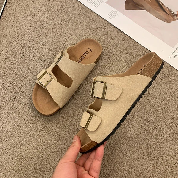 Women's cushioned slip-on buckle sandals with contoured footbed in modern slide silhouette