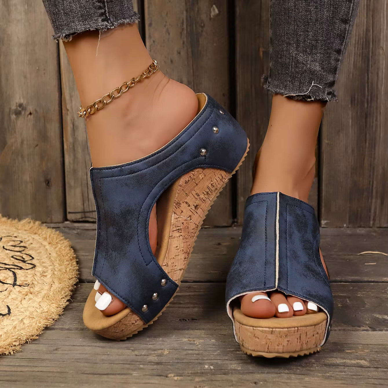 Women's wedge sandals with sleek straps and chic metallic studs for bold elegant style