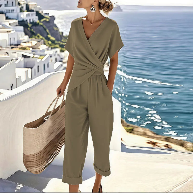 Elegant two-piece wrap-front top and tailored cropped trousers set with feminine silhouette