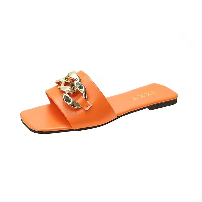 Women's vegan leather slide flats with bold gold chunky chain strap accent, sleek summer style