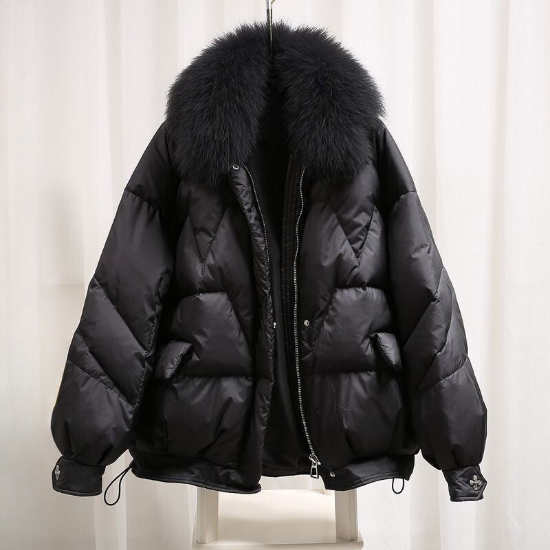 Women's black puffer coat with faux fur collar, elegant slim cut and HeatLock insulation