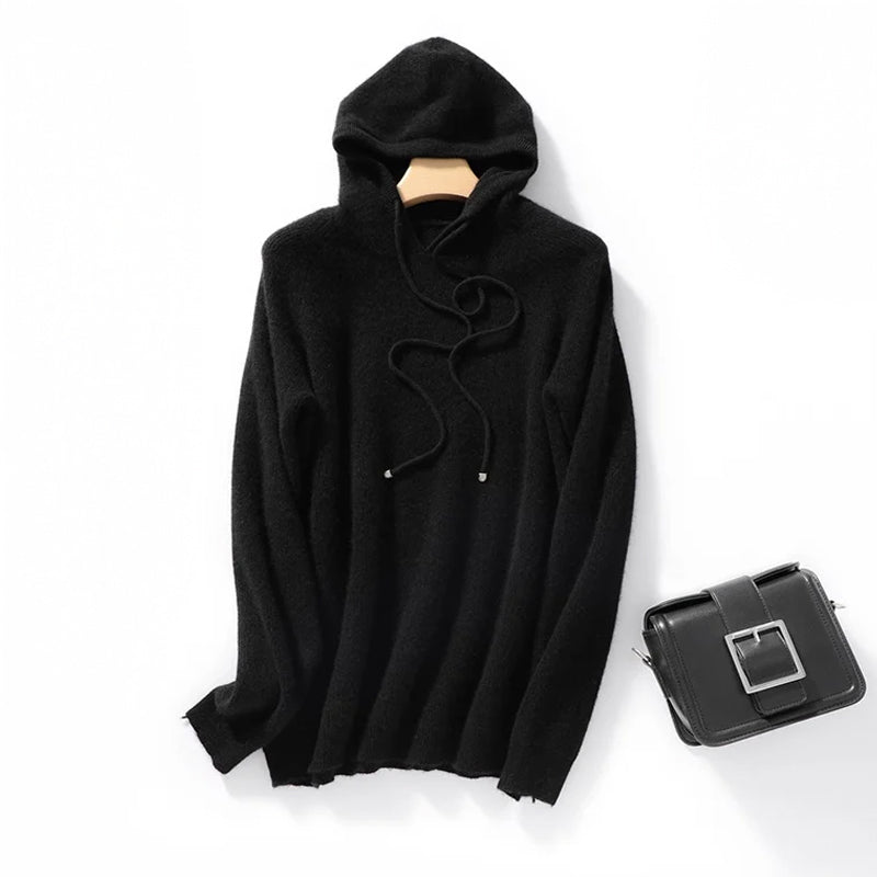 Beige relaxed ribbed hoodie in soft wool blend with long drawstrings and modern loose silhouette