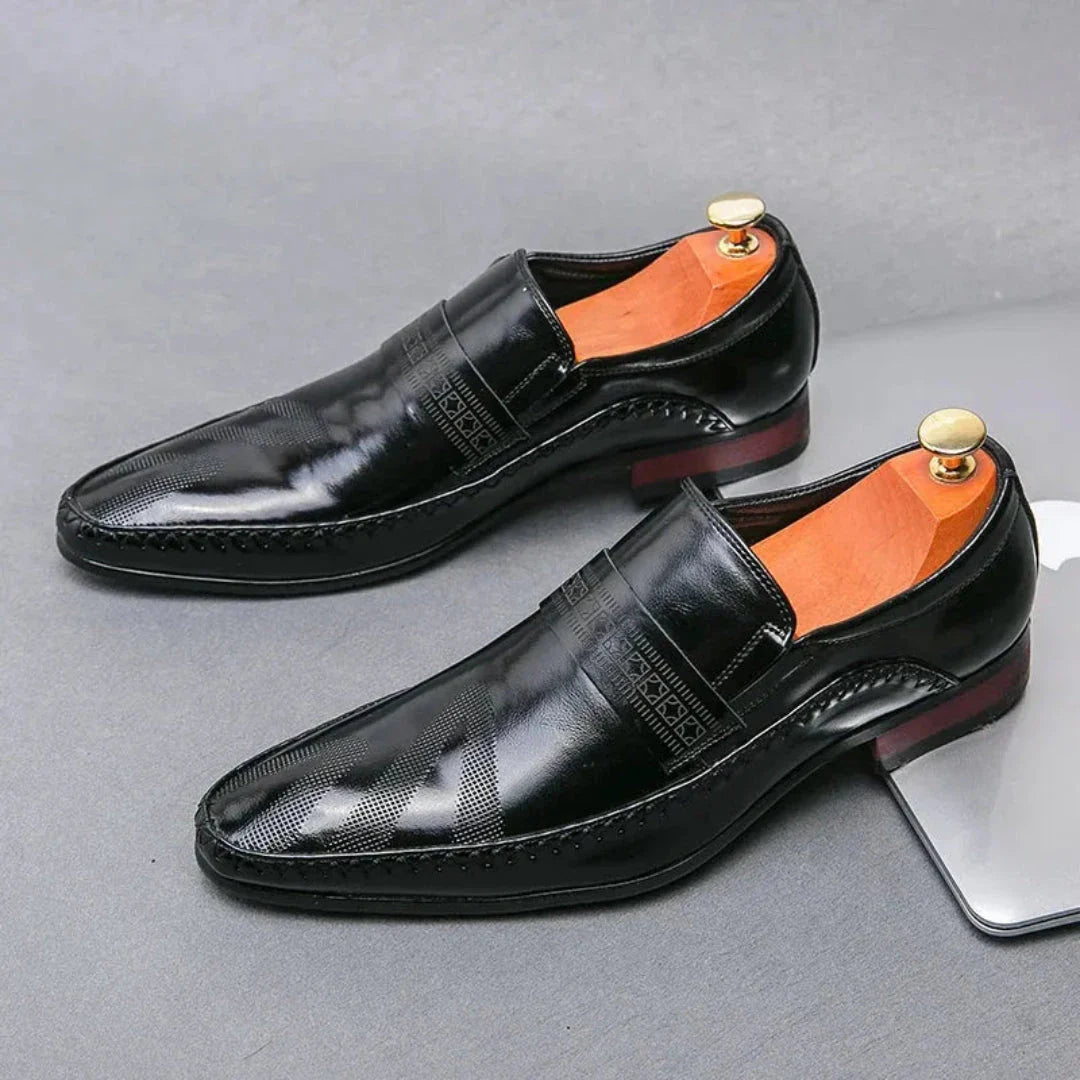 Silvano slip-on leather dress shoes in classic black with polished finish and loafer silhouette