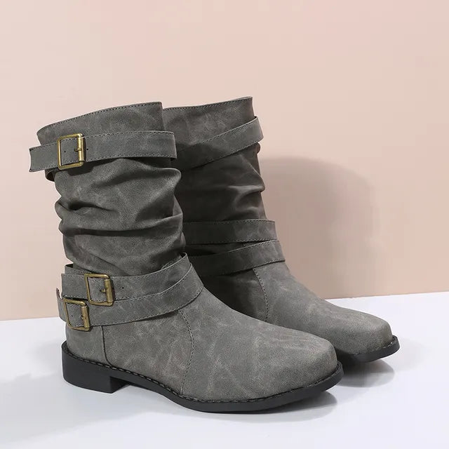 Women's brown slouch mid-calf boots with buckle strap detail, flat sole, effortlessly chic style
