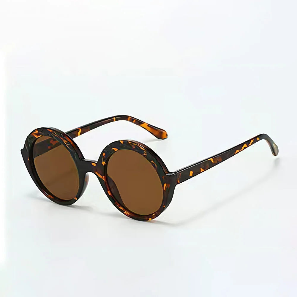 Retro round acetate sunglasses with gradient UV400 lenses and sculpted frame for a bold 70s look