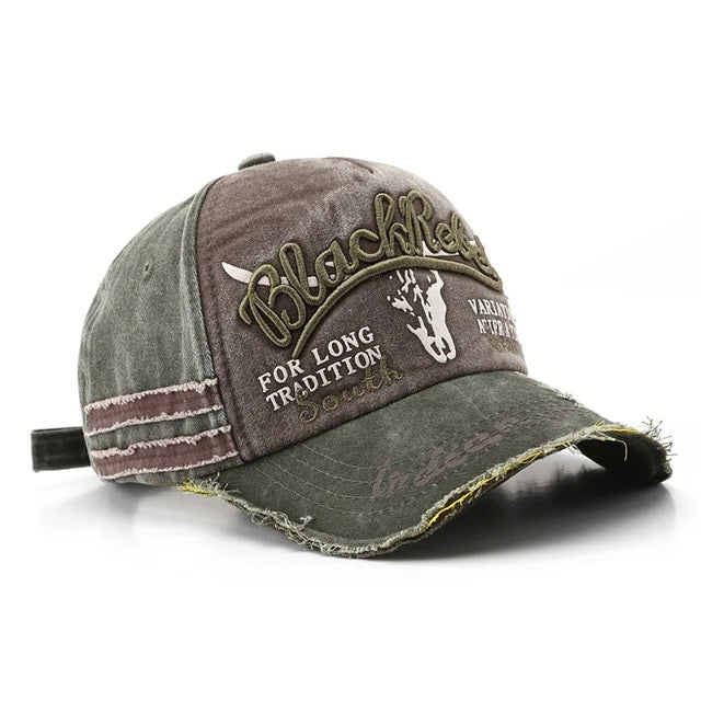 Black cotton trucker hat with embroidered Rebel lettering, distressed detailing, and adjustable snapback closure