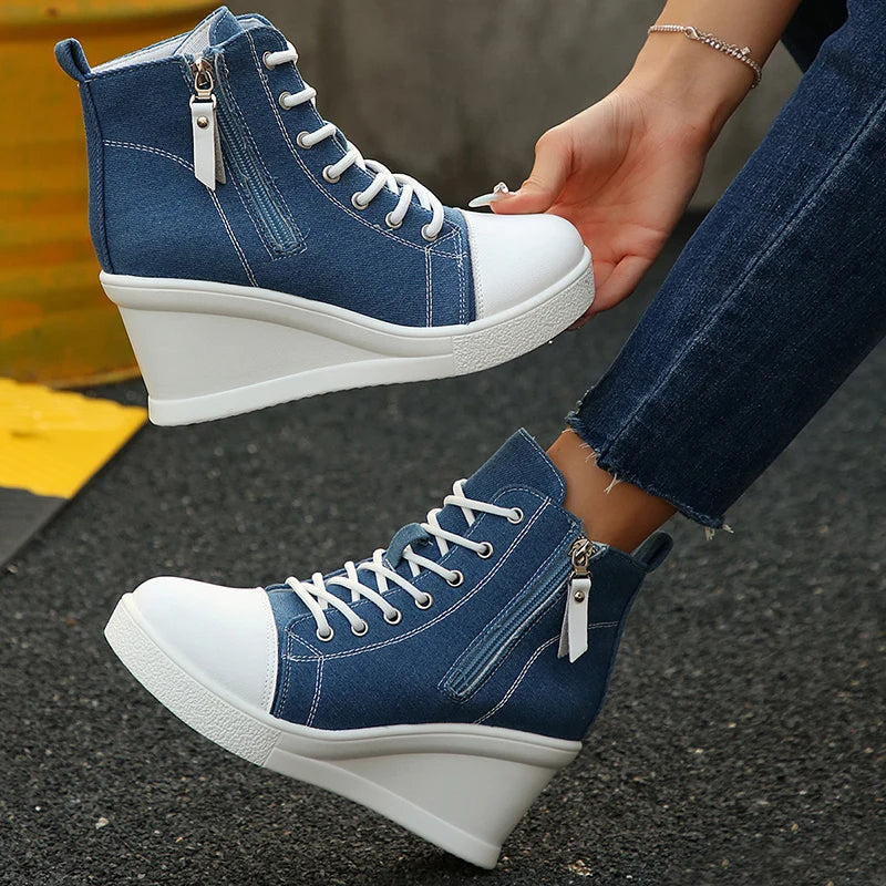Rowan white canvas wedge sneaker with hidden heel lift, rubber toe cap, and side zipper