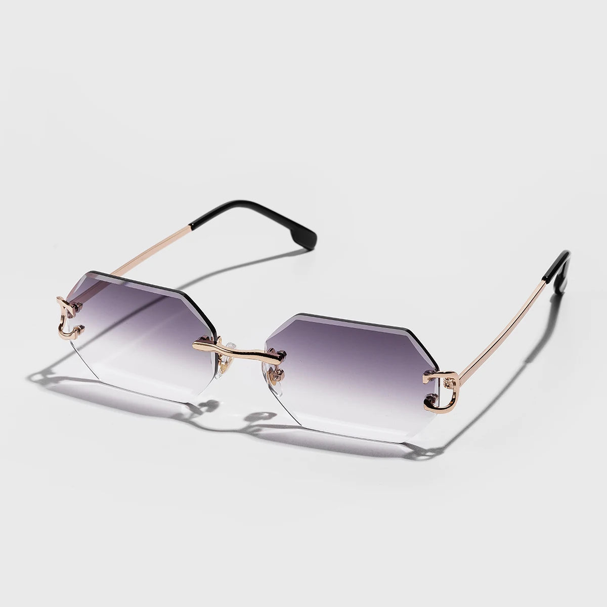 Rimless octagonal sunglasses with UV400 gradient tint and sleek metallic temples for minimalist style