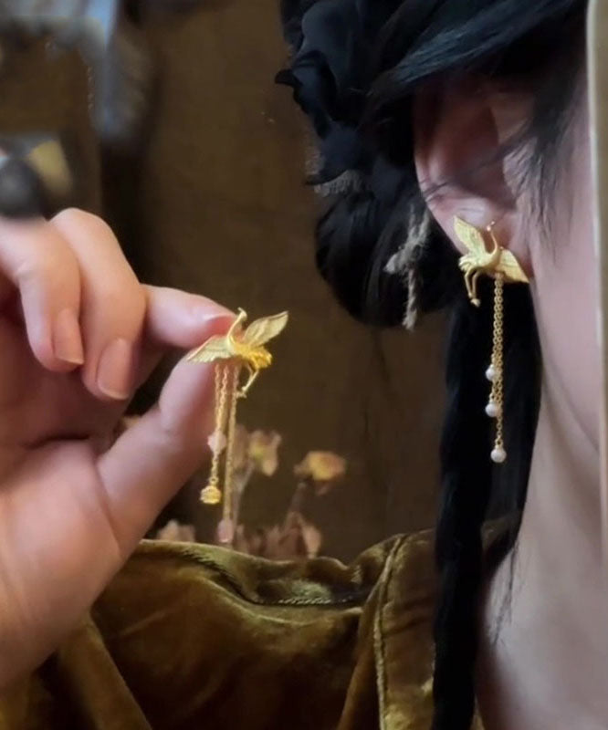 Boucles d'oreilles pendantes vintage en alliage de cuivre dorΓ© et pompon en forme de grue - Wavlynn