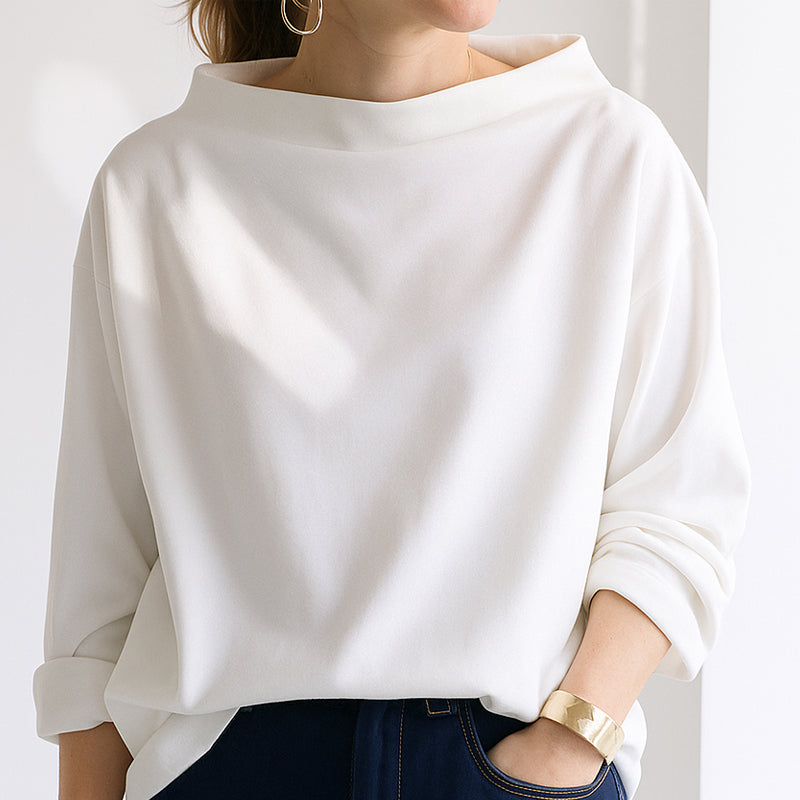 Women's cream oversized top with folded wide neckline, dropped shoulders, and gathered long sleeves