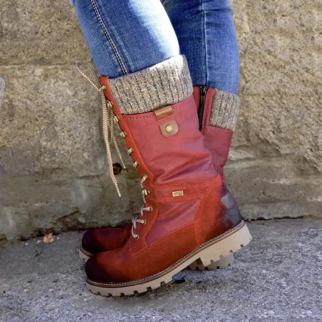 Women's black lace-up winter boots with waterproof upper and thick thermal lining for cold weather