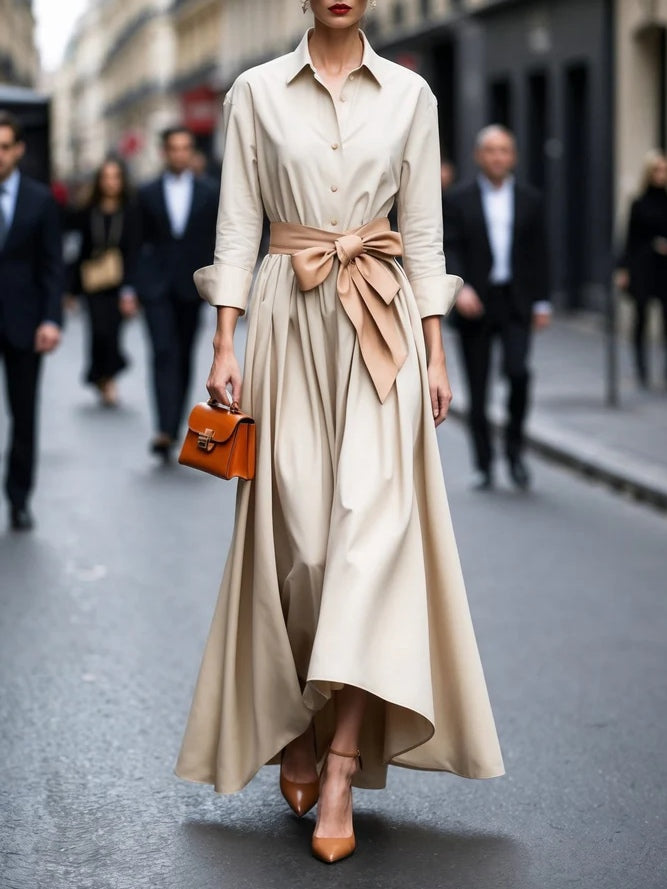 Elegant black long-sleeve tie-waist maxi dress with shirt-style design and flowing silhouette
