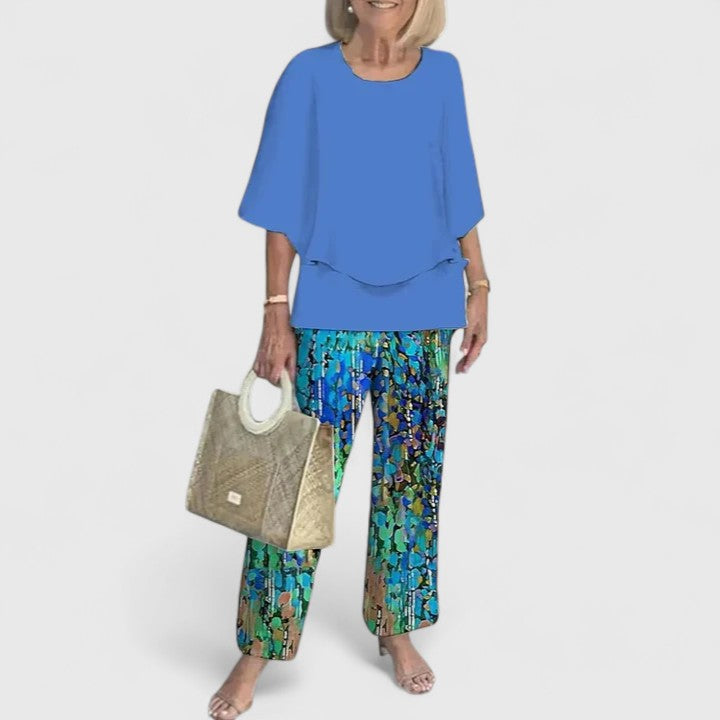 Sage green floral two-piece set with layered relaxed top and wide-leg botanical print pants
