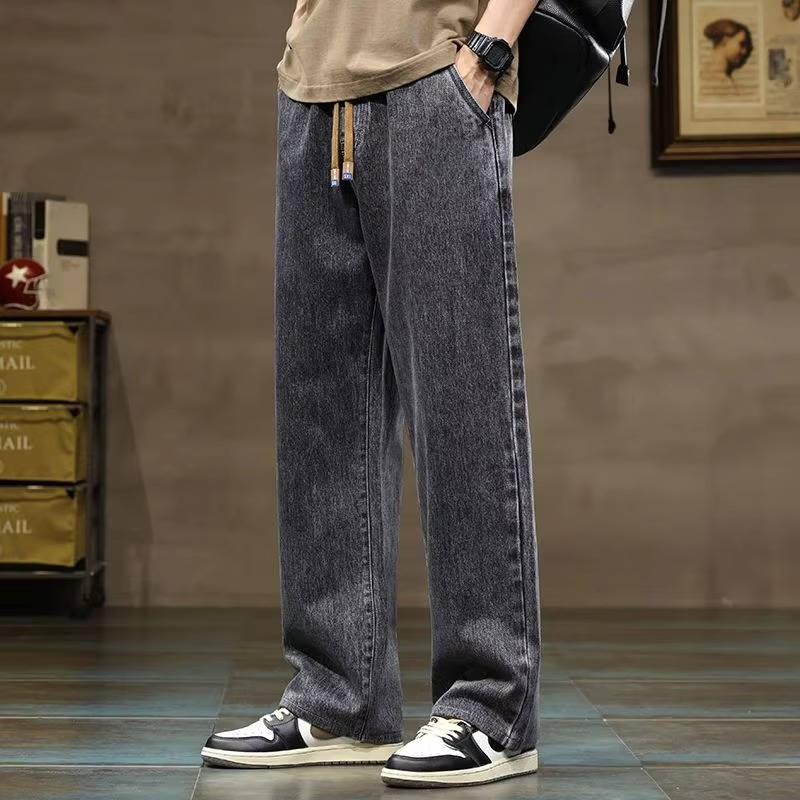 Men's relaxed fit drawstring denim jeans in classic blue, elastic waist pull-on style for everyday comfort