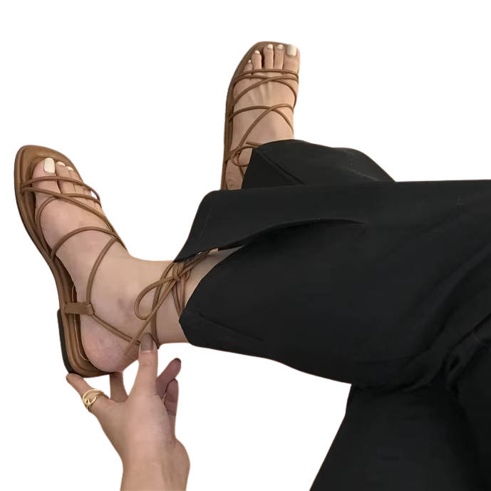 Women's strappy lace-up flat sandals with wrap-around ankle lacing, vintage-inspired minimalist design