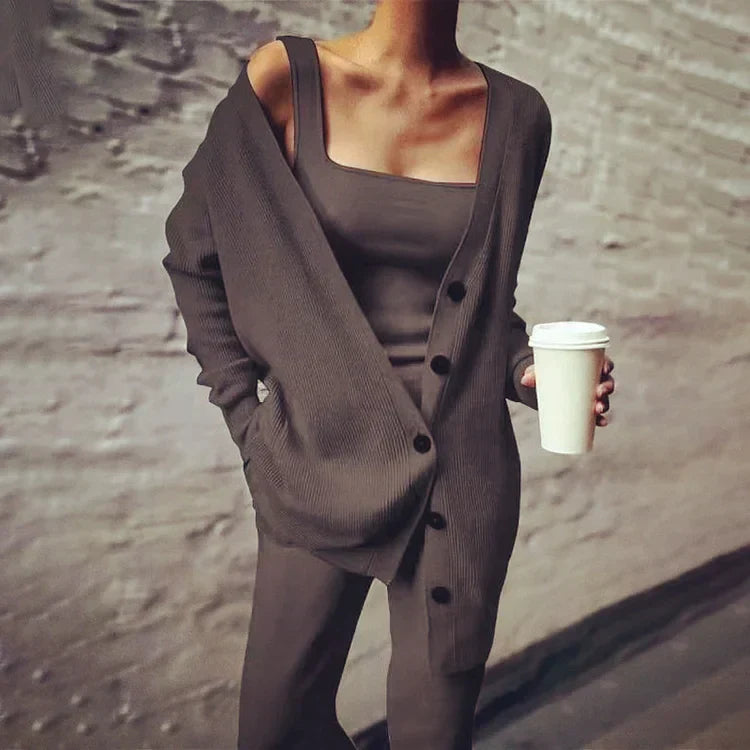 Women's oversized long rib-knit cardigan in neutral tone with button closure and side pockets