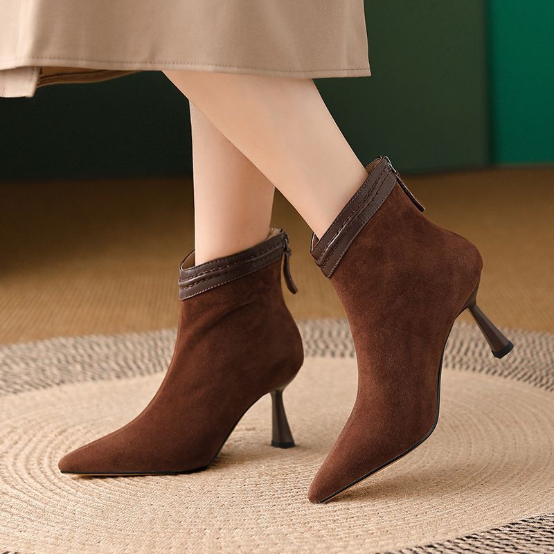 Black Laura™ sleek ankle boots with smooth contoured silhouette and leg-lengthening streamlined design