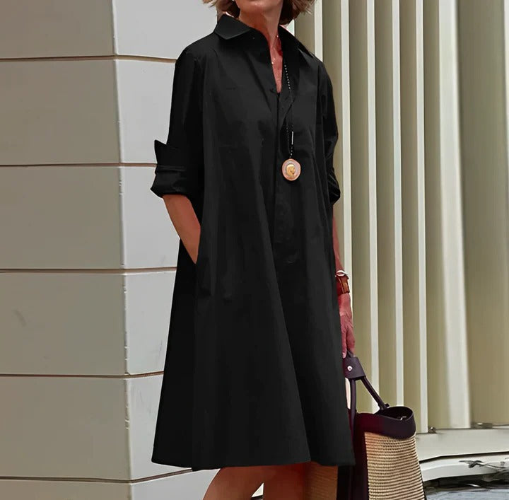 Casual white shirt-style dress with relaxed fit and full-length hem, perfect for everyday wear