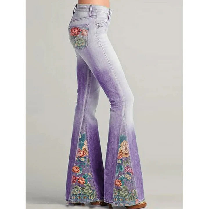 Women's vintage blue flare jeans with intricate floral embroidery along pockets and legs