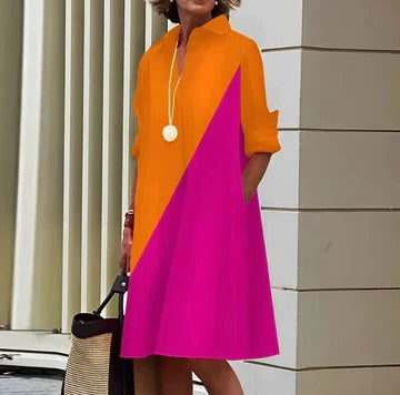 Women's navy polo dress with structured collar, short sleeves, and straight-cut silhouette for casual chic style