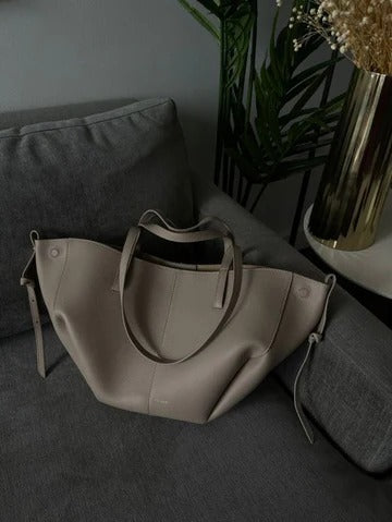 Vintage women's tote bag in elegant neutral tones, spacious all-day carryall with secure closure