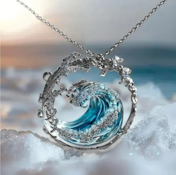 Judith wave pendant necklace with blue resin centerpiece and cubic zirconia accents, coastal charm