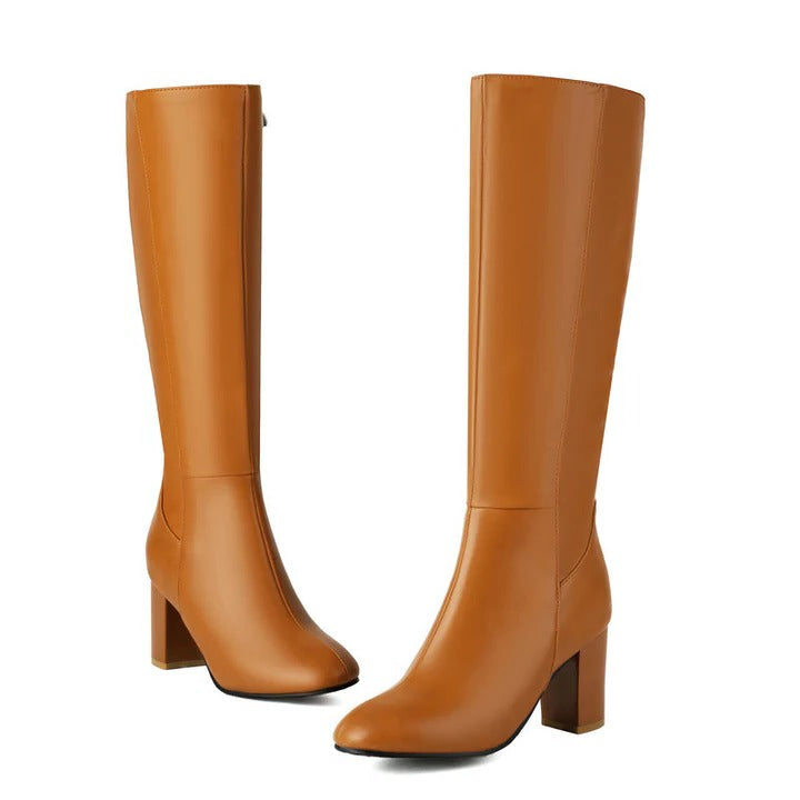 Women's tall knee-high winter boots in classic black with sleek silhouette and side zipper closure