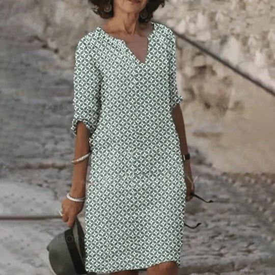 Women's relaxed-fit knee-length dress with wide rounded neckline, lightweight breathable fabric for warm weather