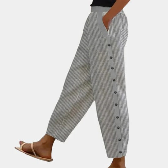 Women's straight-leg striped trousers with button-zip waistband, full-length neutral silhouette