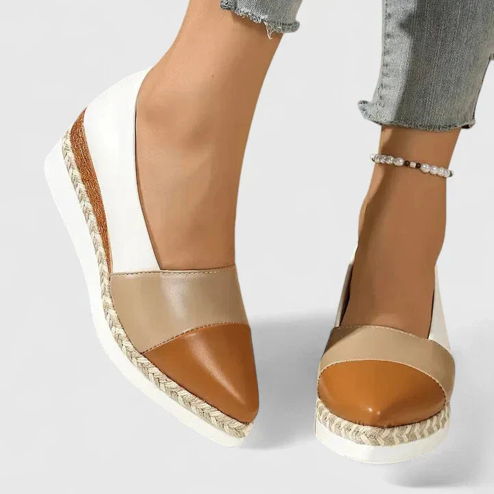 Women's beige comfort loafers with cushioned footbed, structured slip-on design for all-day comfort