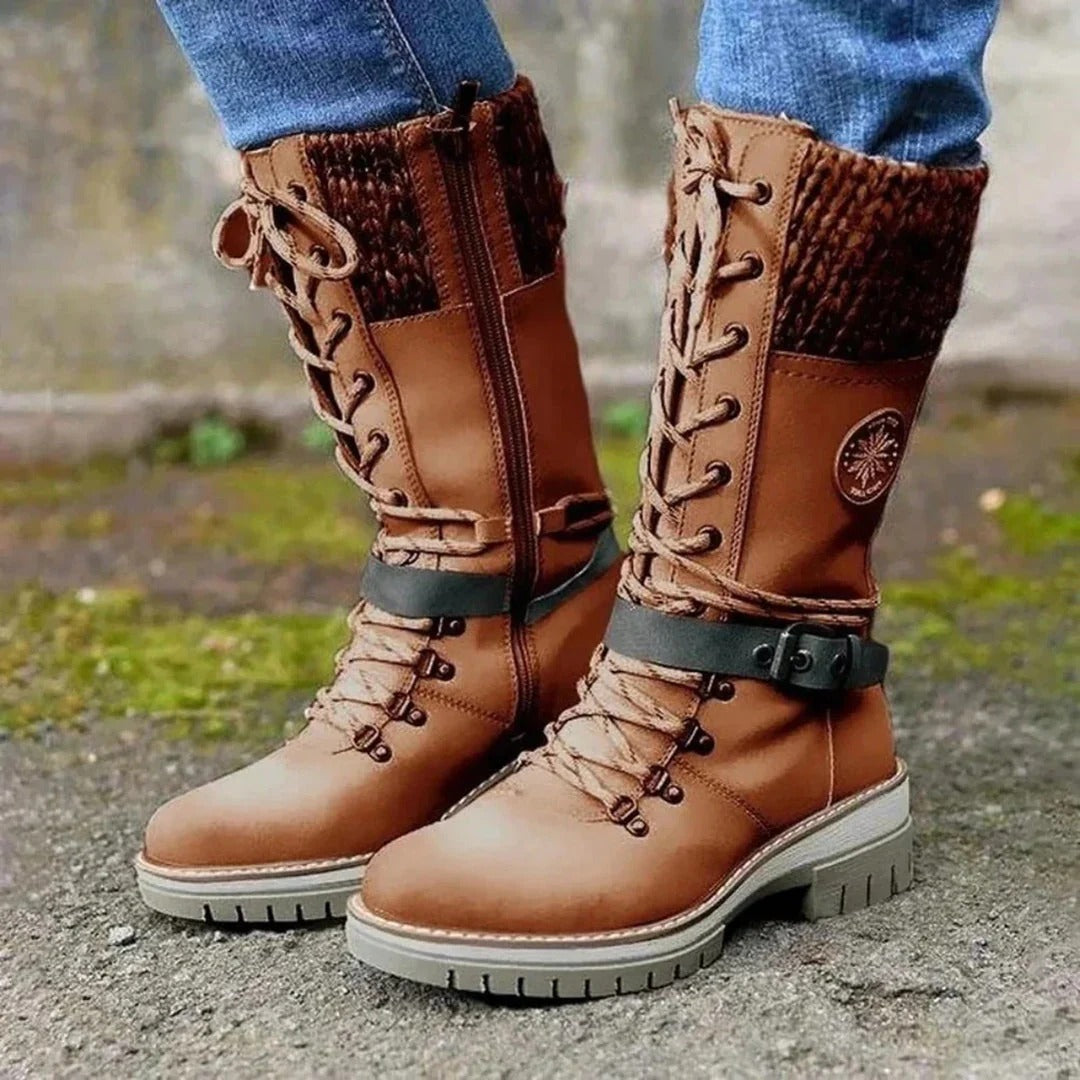 Women's brown knee-high lace-up boots with cuff detail, elegant leg-lengthening silhouette