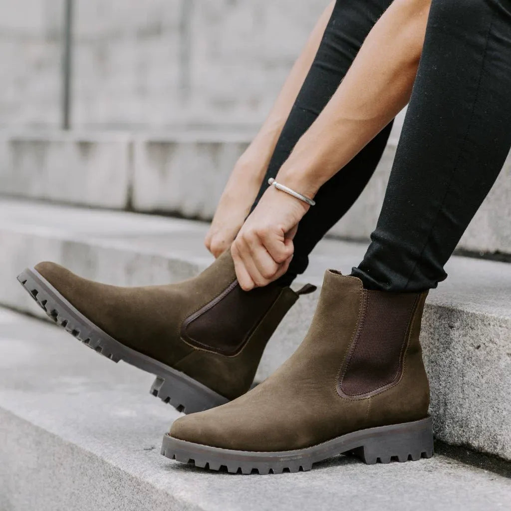 Women's black ankle boots chunky lug sole sleek upper bold contemporary silhouette leg-lengthening