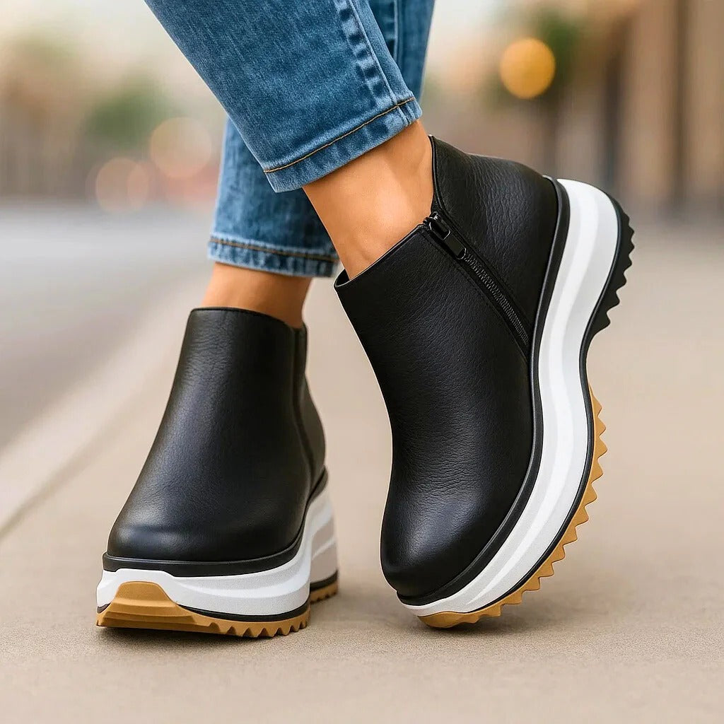 Cassien minimalist leather platform boots in neutral tone, sleek silhouette with elevated chunky sole