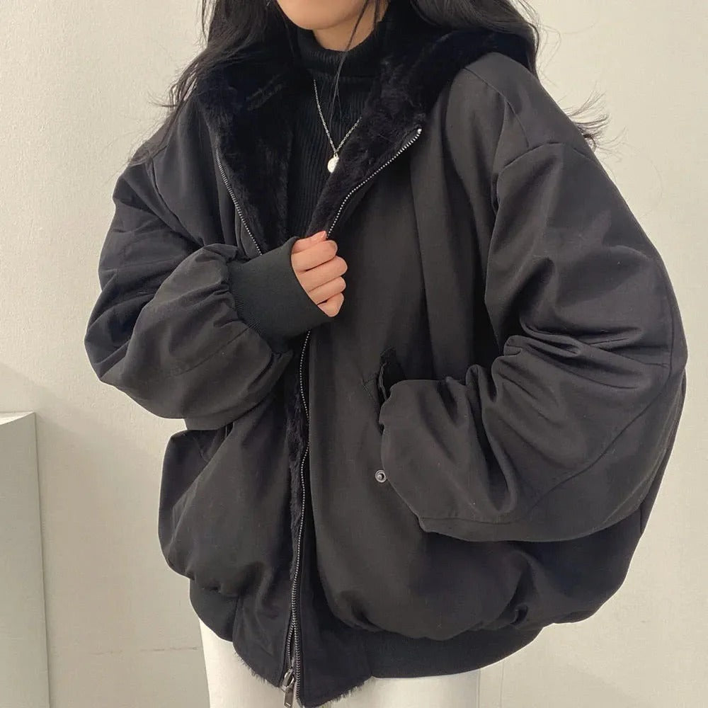 Women's relaxed fit jacket with plush lining, ribbed cuffs, zipper closure, and double-layer construction