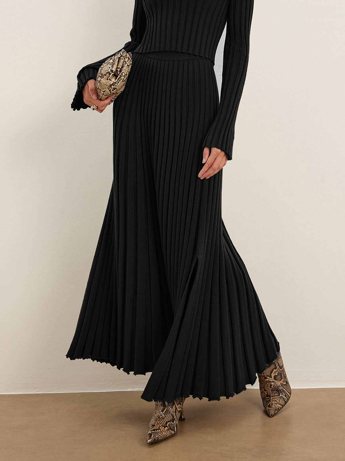 Knit pleated sweater skirt with lettuce trim, casual mid-waist shift style in neutral tone