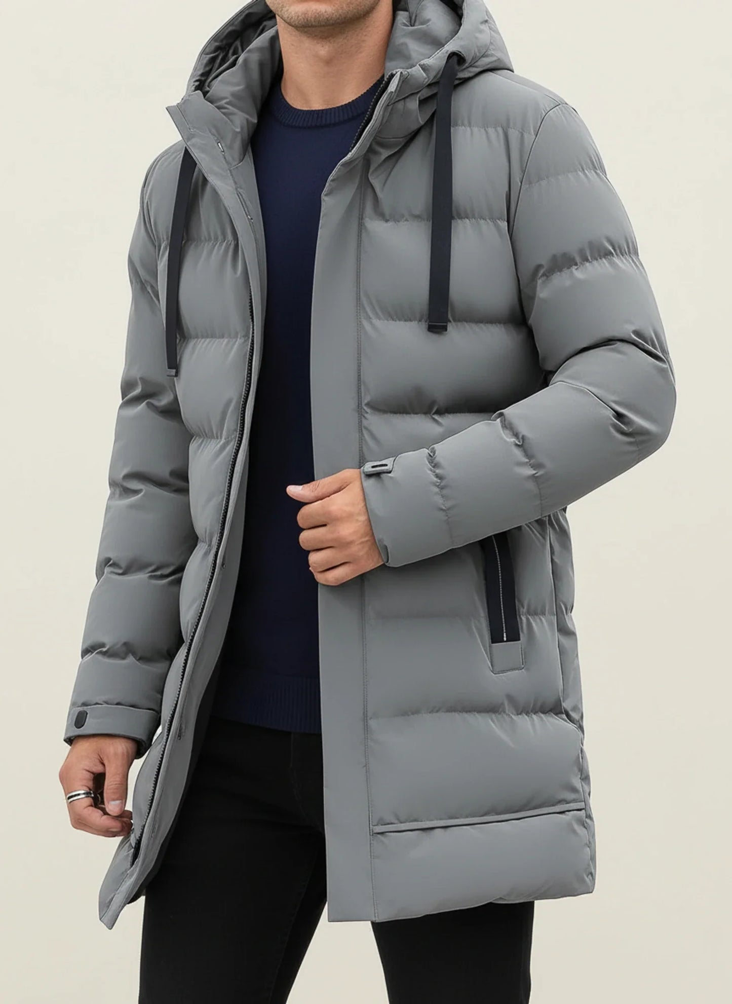 Men's black longline hooded puffer jacket with zip front, insulated quilted design for winter warmth