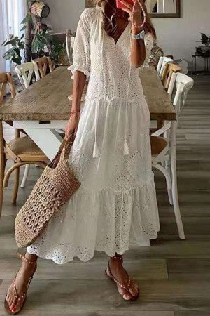 Women's boho floral print maxi dress with tassel V-neckline, flowing A-line silhouette in watercolor botanical print
