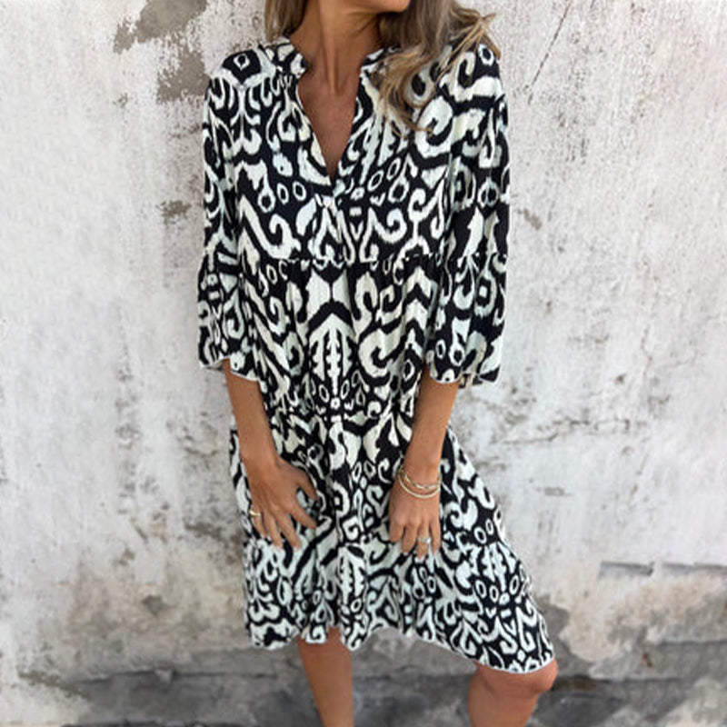 Women's printed draped elegant dress with chic patterned sleeves and flattering silhouette