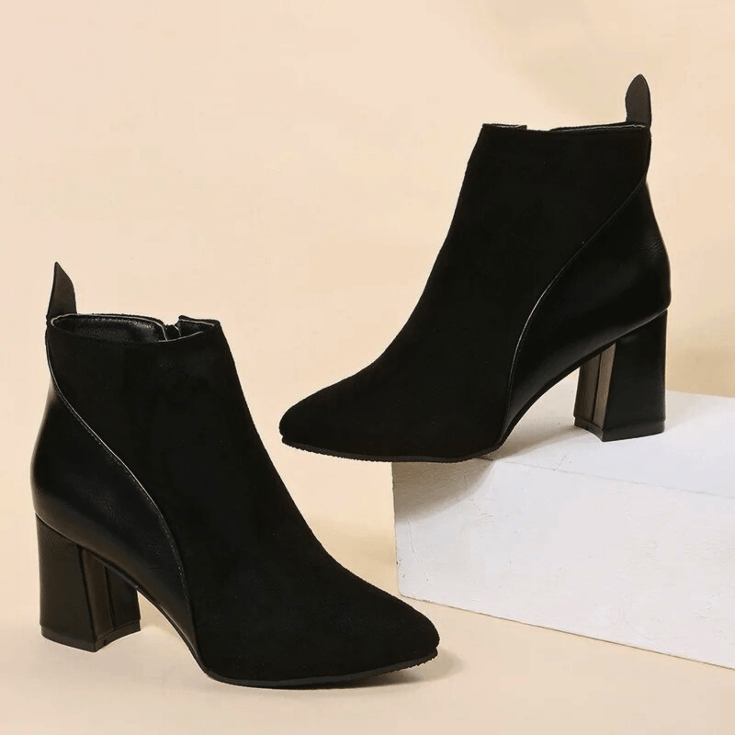 Valmont black pointed-toe booties with sleek contemporary silhouette for effortless modern elegance