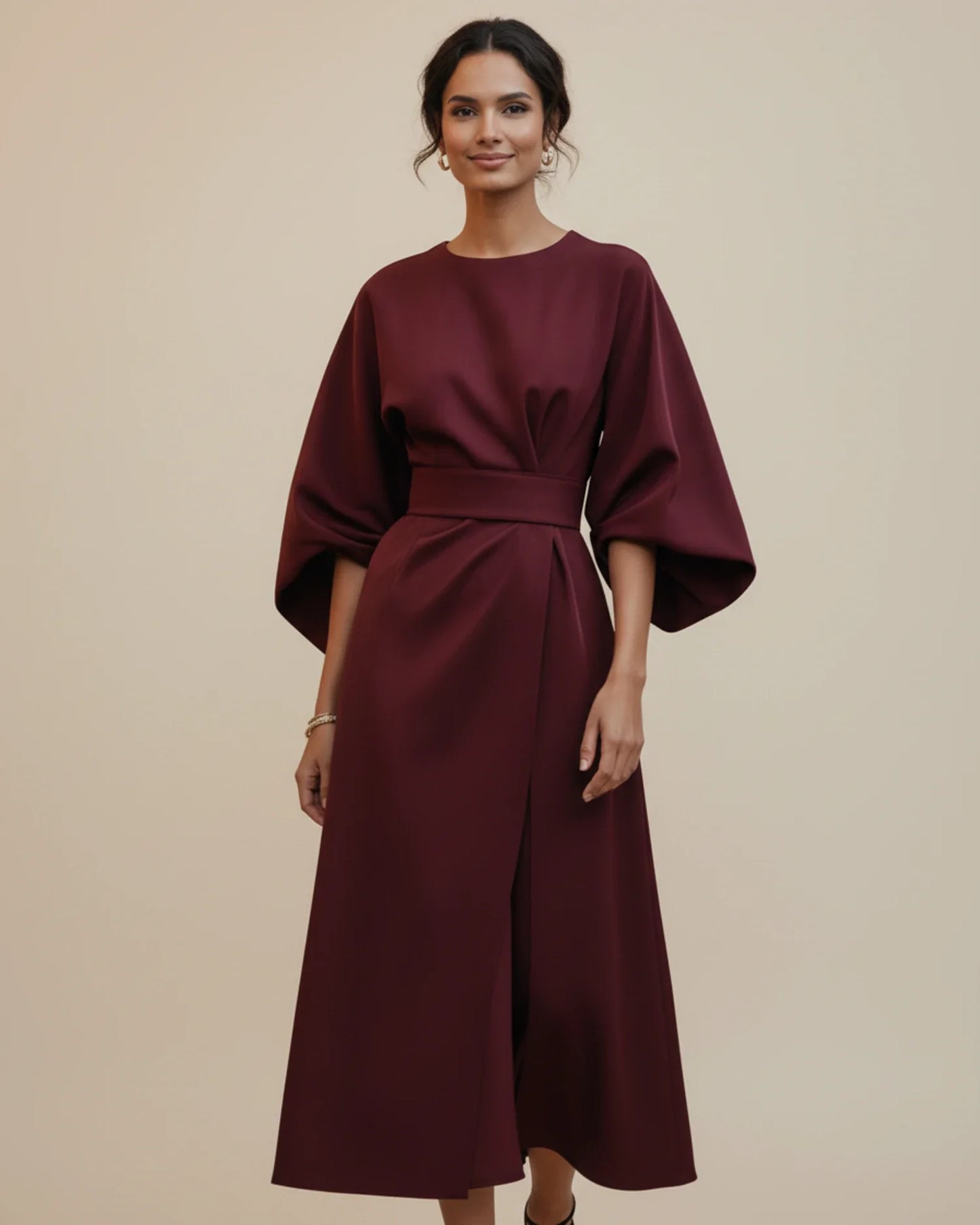 Women's elegant midi wrap dress in neutral tone with belted waist and voluminous lantern sleeves