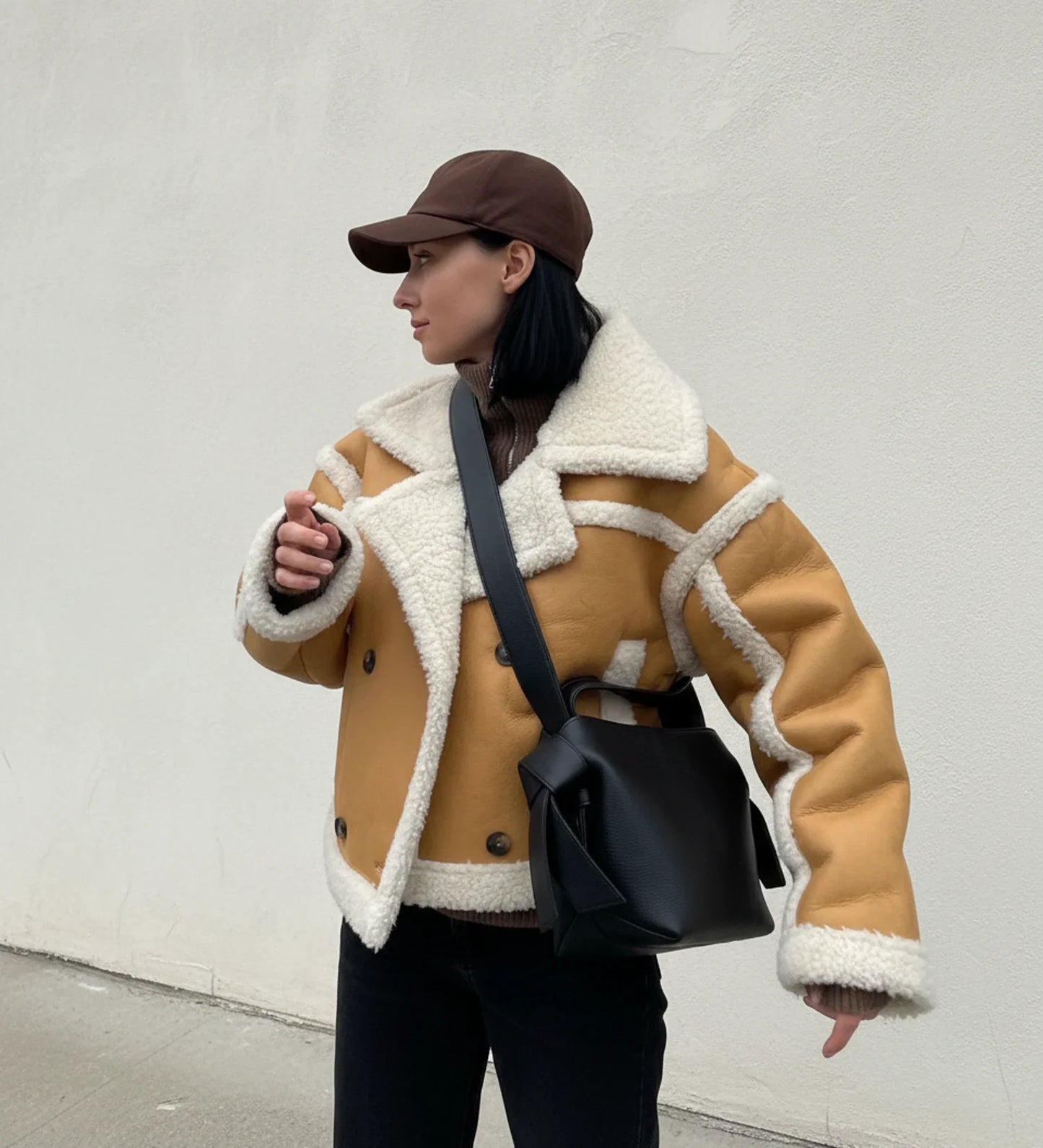 Women's cropped shearling aviator jacket in chic style with double-breasted design and contrast trim