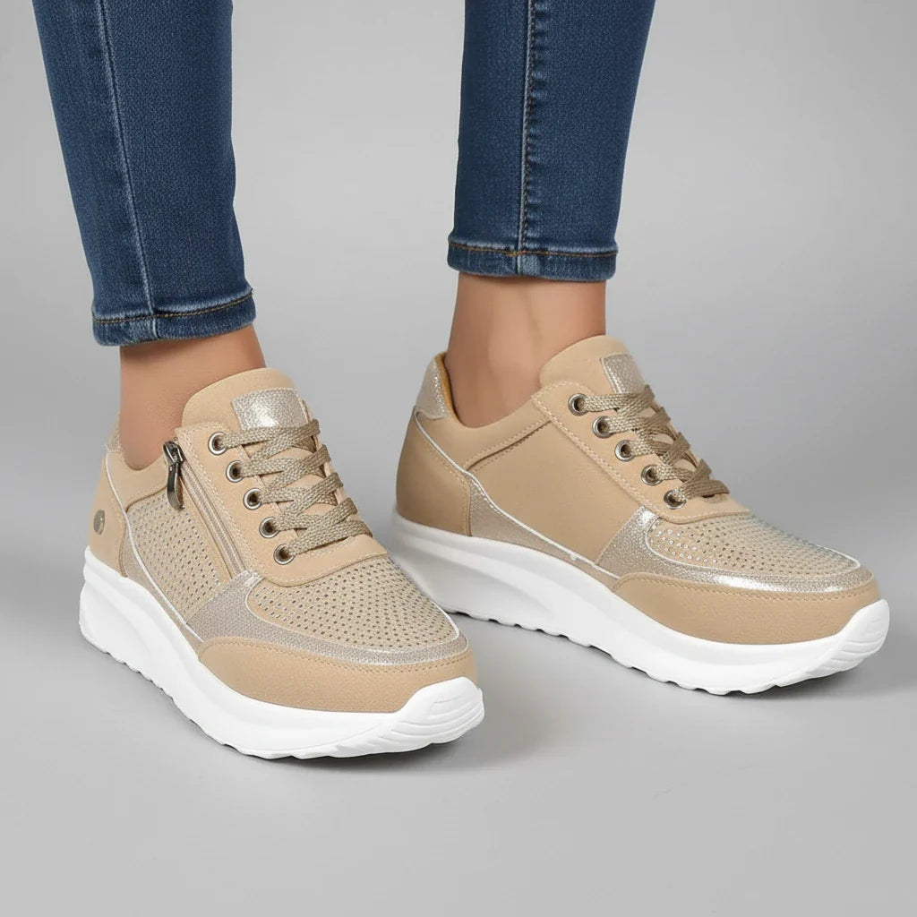 Women's white platform sneakers with side zip detail and chunky cushioned sole for casual street style
