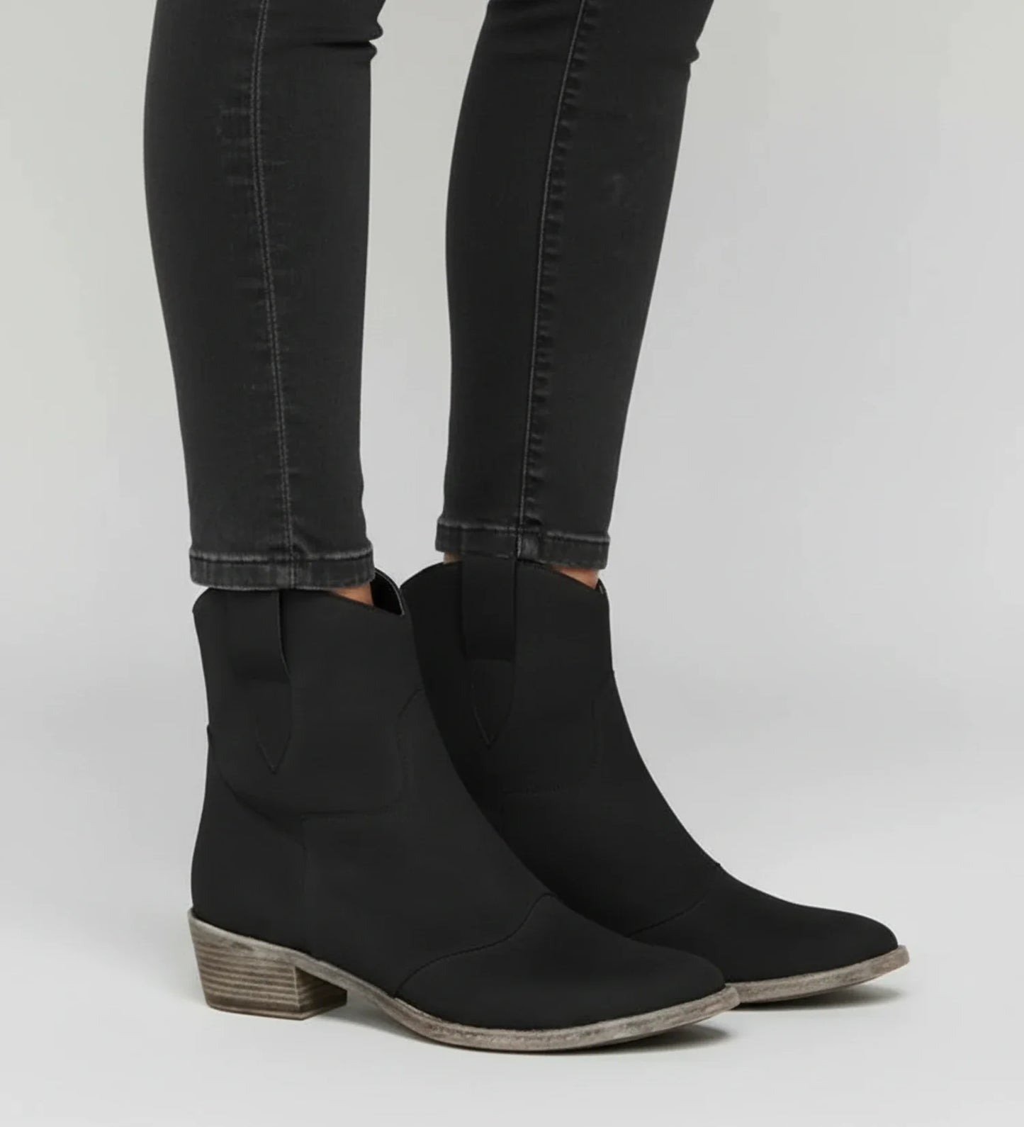 Women's brown western ankle boots with low block heel, slouchy pull-on silhouette for daily wear