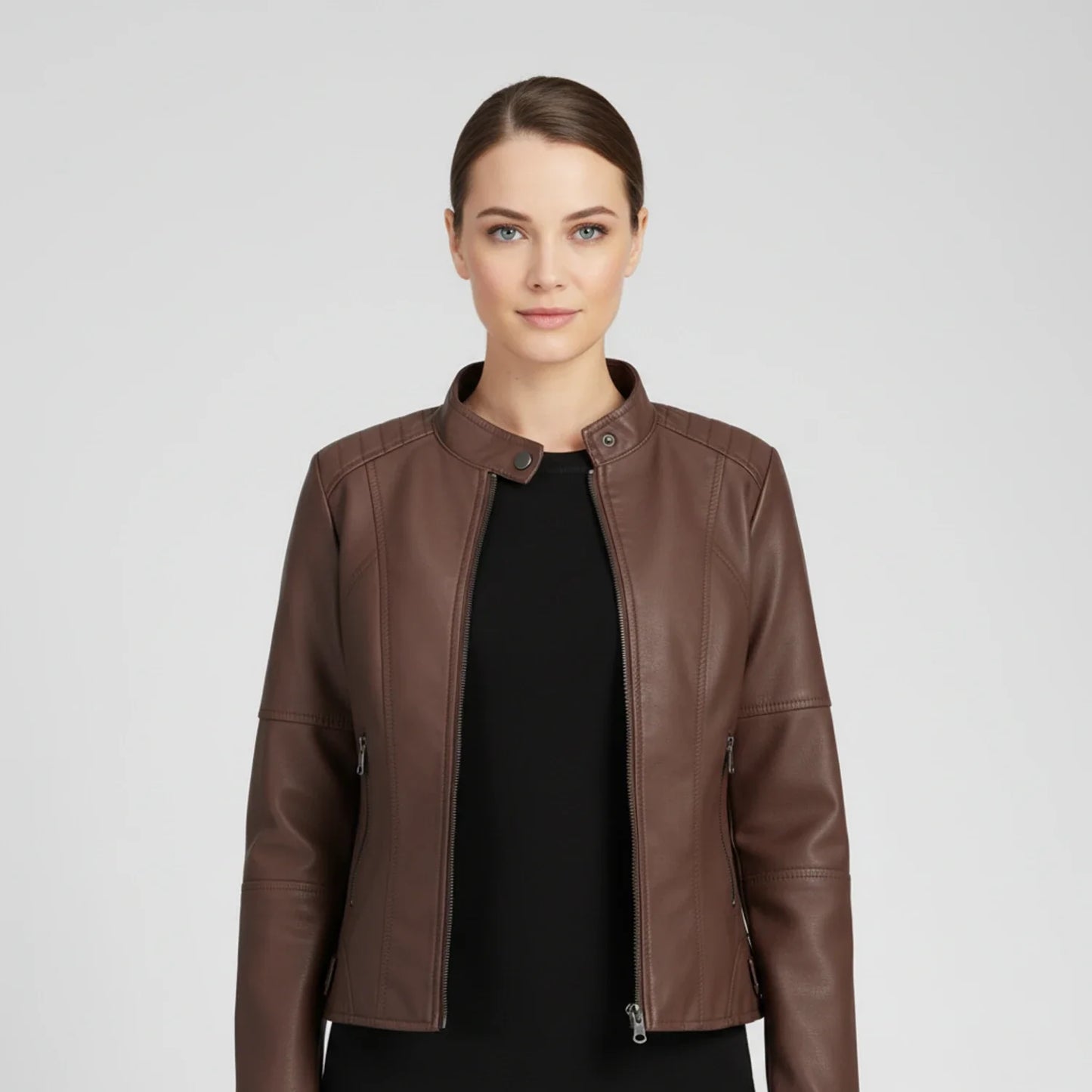 Women's black moto biker jacket with zip pockets, stand collar, and fitted silhouette