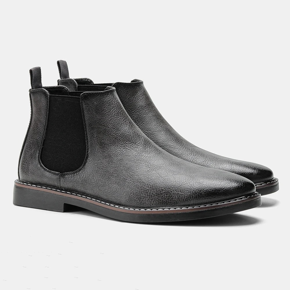 Men's brown leather Chelsea boots with almond toe, elastic side gussets, and low block heel
