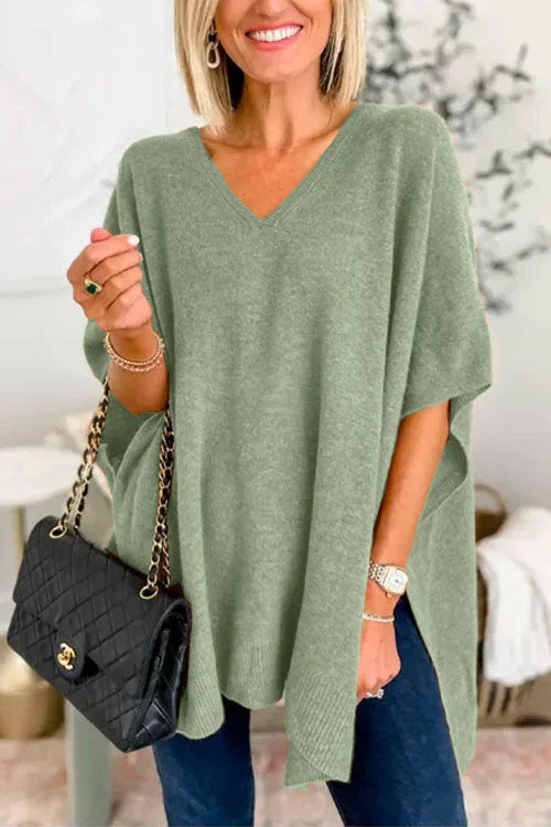 Women's soft knit poncho top loose fit V-neck draped design in warm neutral tones