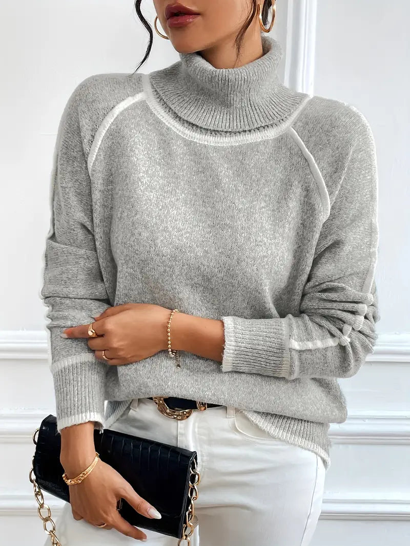 Cream relaxed-fit turtleneck sweater with velvety knit texture and contrasting seam trim details