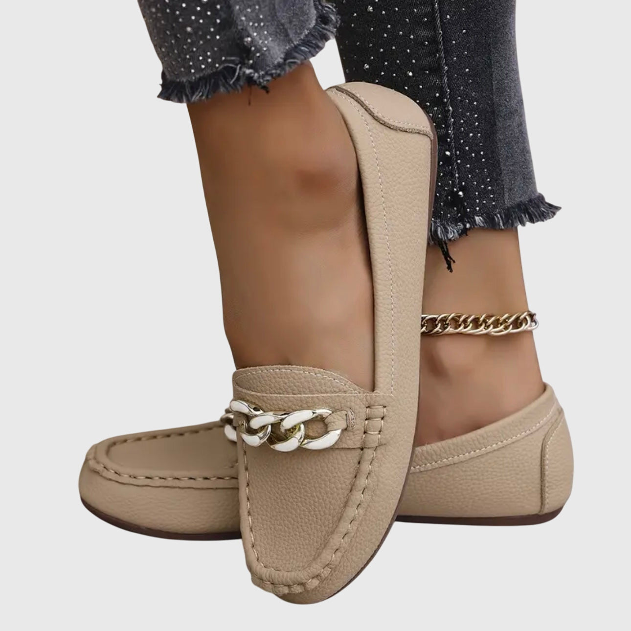 White women's slip-on flat loafers with chunky gold chain hardware accent, casual elegant style