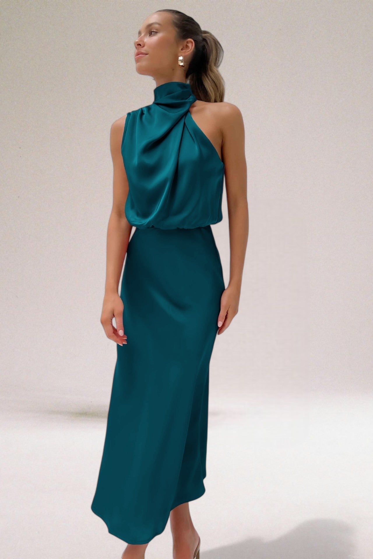 Elegant halter neck dress in sleek silhouette with radiant finish, designed for special occasions