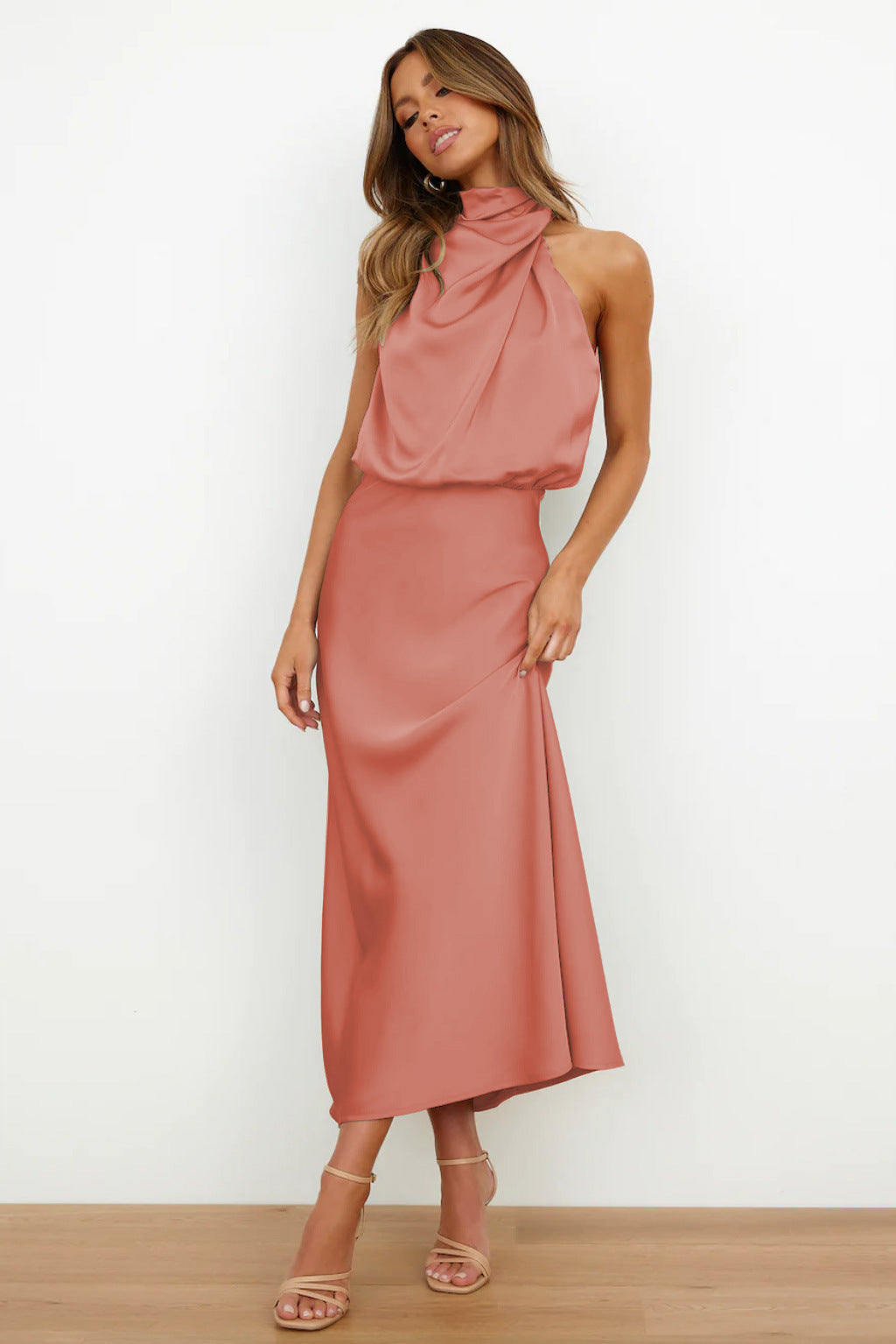 Satin maxi dress in elegant finish, sleeveless V-neckline silhouette with flowing drape for formal events